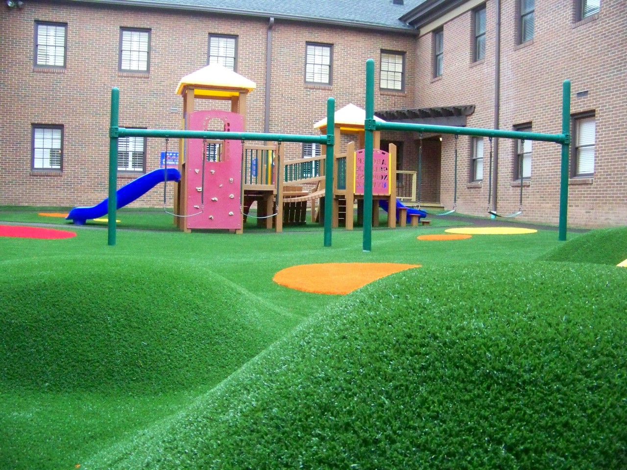 Hilly artificial turf playground by Southwest Greens Ontario